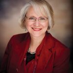 A professional photo portrait of Dean Kate VandenBosch